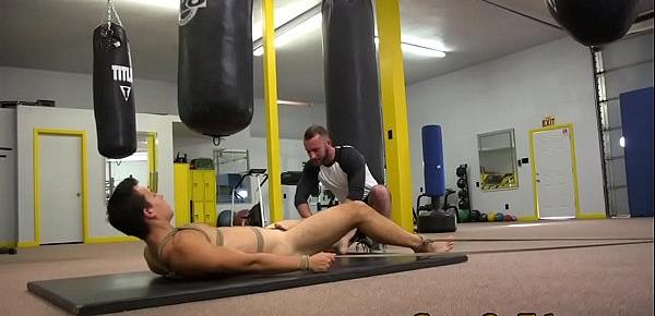  BDSM doms share restrained subs cock in gym